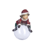 Julbarn på glaskula